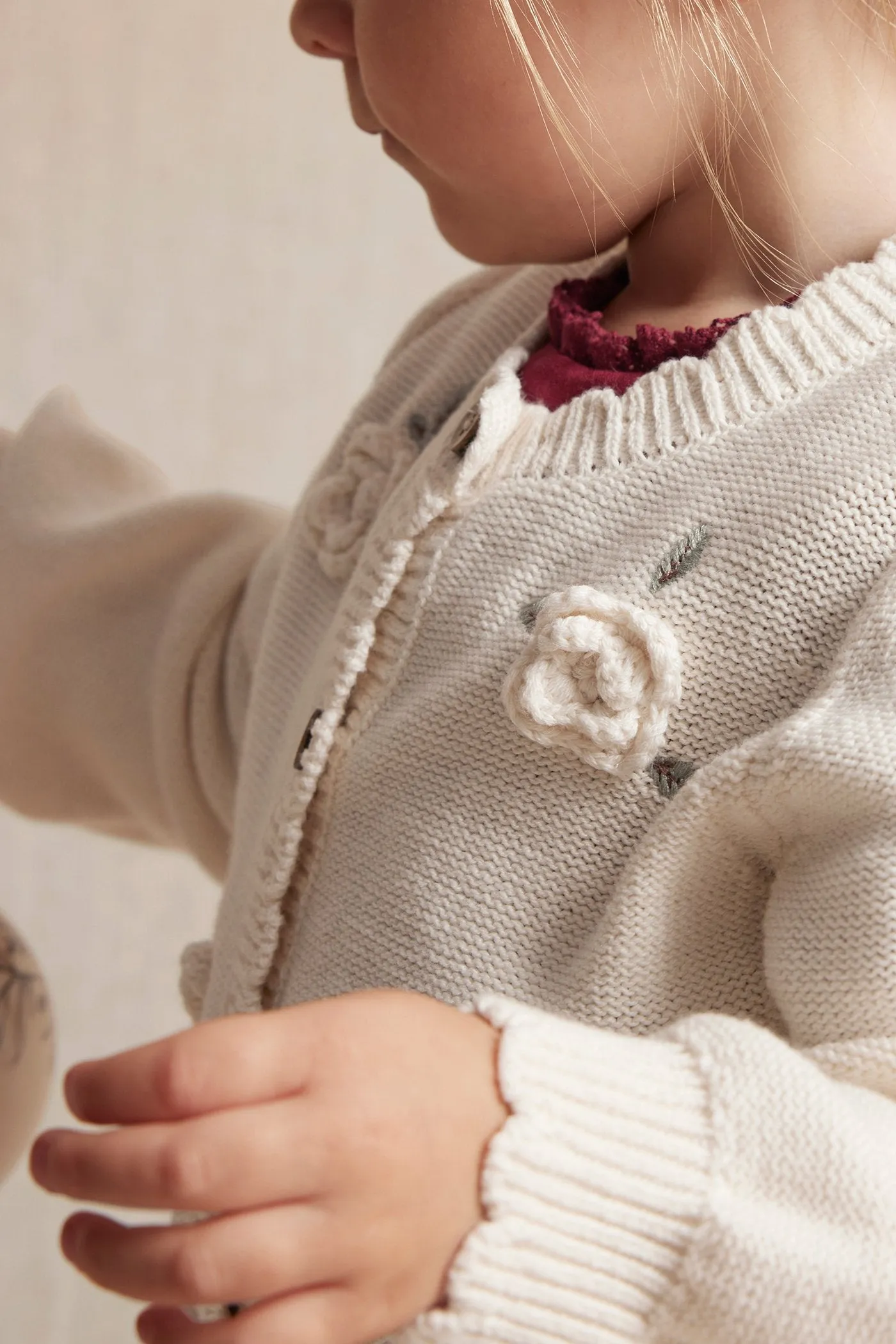 Baby white knitted cardigan